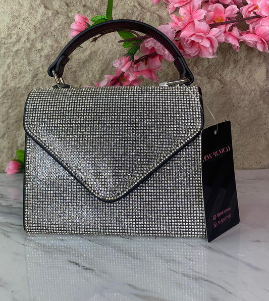 BOLSO DE MANO CON BRILLOS PLATEADOS